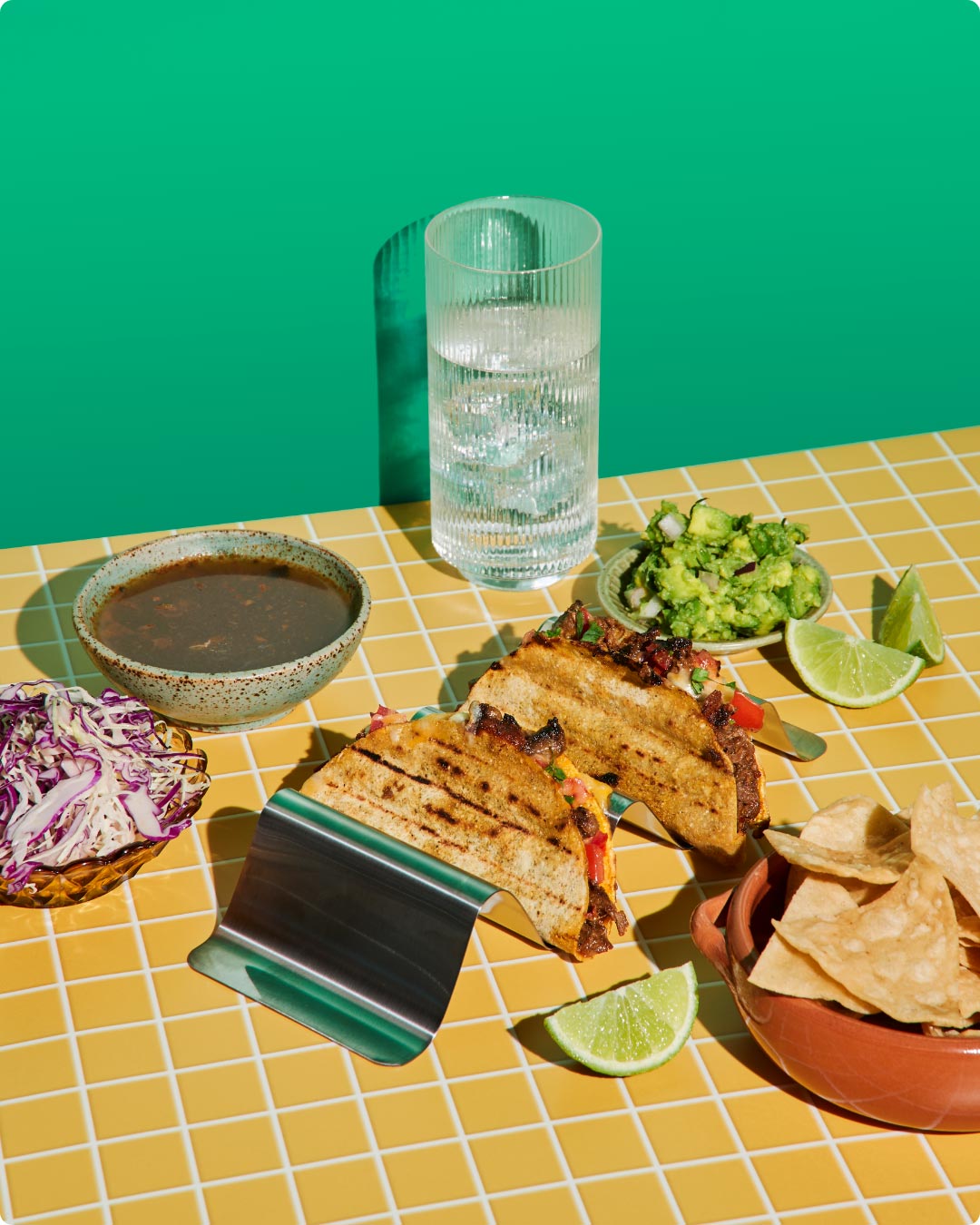 A Salsas spread — grilled tacos, guacamole, lime, slaw and chips